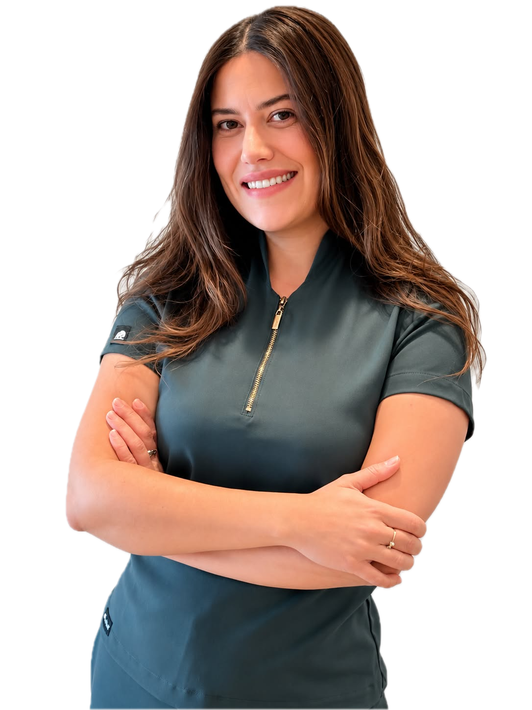 Dr. Kamila Rodriguez smiling with arms crossed in dark green clinical scrubs.